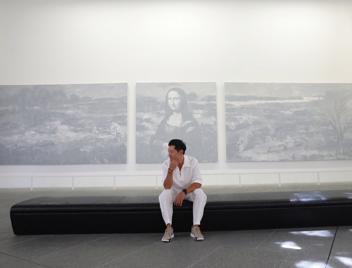 Joe Ho seated before the Mona Lisa — between cultures